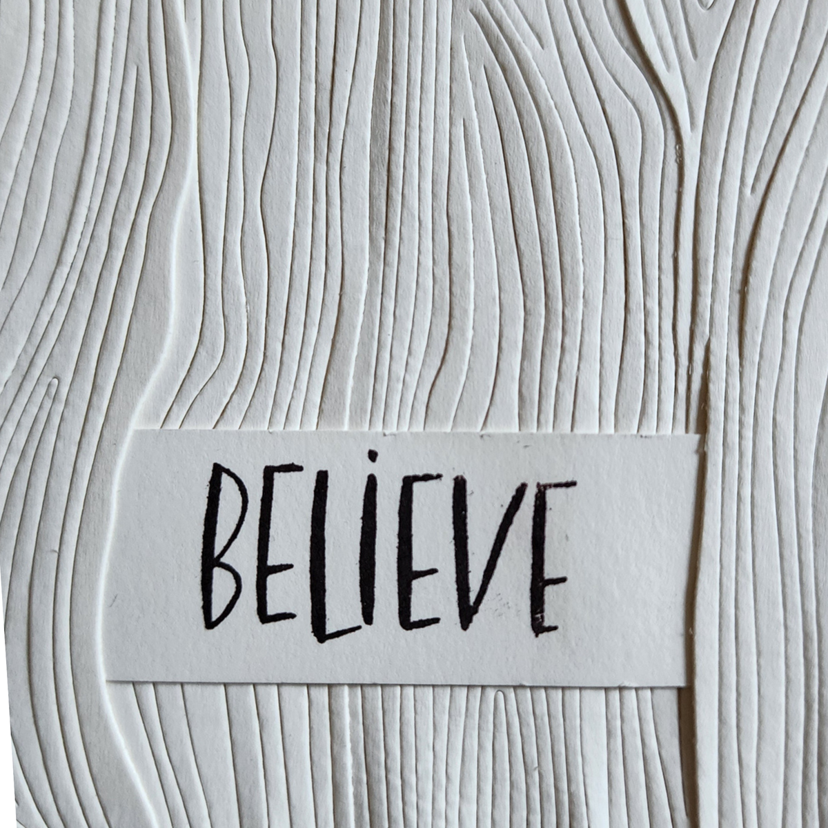 Believe Ivory Woodgrain Embossed Notecard | Elevated Giving Co
