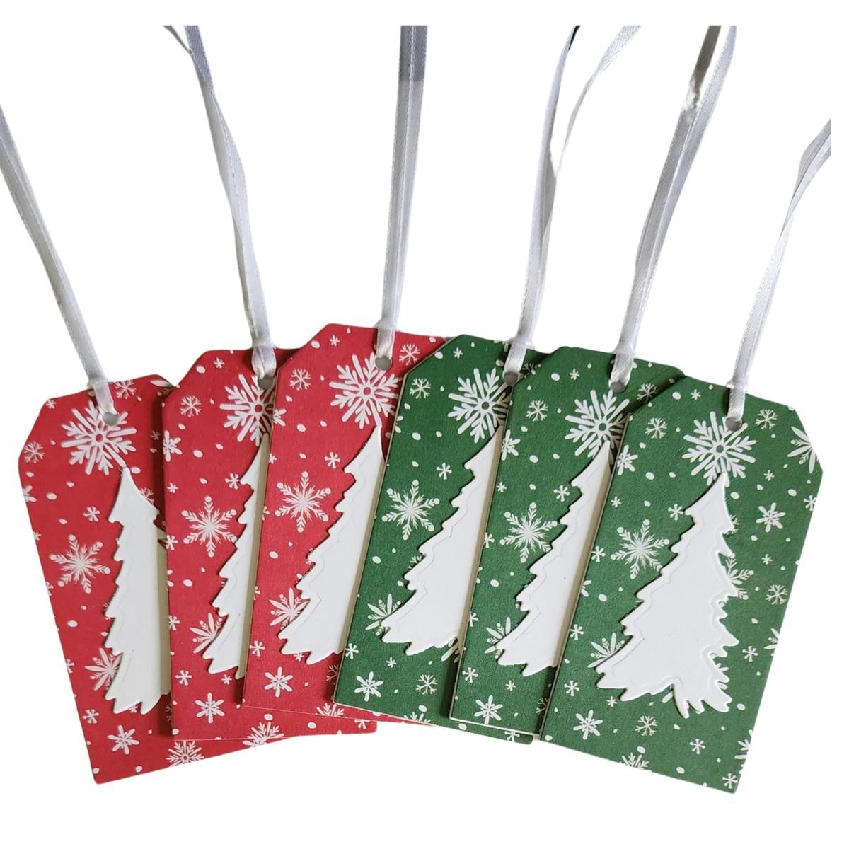 Set of six handmade Christmas gift tags featuring three red and three green snowflake designs with dimensional white Christmas trees.