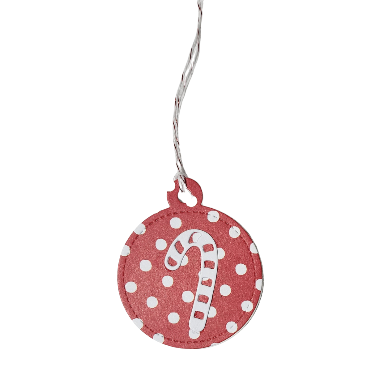 Single candy cane tag	Handmade round red Christmas gift tag with white polka dots, raised candy cane embellishment, and red and white cord
Assorted set of 10	Set of ten handmade red and white Christmas gift tags featuring assorted candy cane, peppermint, Christmas tree, and holiday greeting designs
Back of tag	White back of round Christmas gift tag featuring red To and From stamped lines
Lifestyle photograph	Red and white Christmas gift tags displayed beside a kraft-wrapped present with striped ribbon, ever