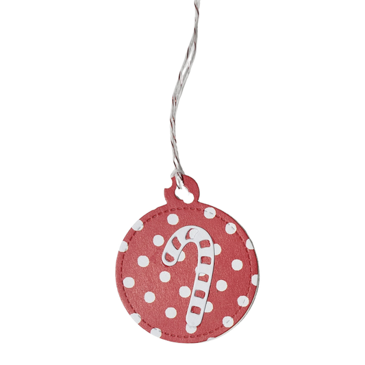 Single candy cane tag	Handmade round red Christmas gift tag with white polka dots, raised candy cane embellishment, and red and white cord
Assorted set of 10	Set of ten handmade red and white Christmas gift tags featuring assorted candy cane, peppermint, Christmas tree, and holiday greeting designs
Back of tag	White back of round Christmas gift tag featuring red To and From stamped lines
Lifestyle photograph	Red and white Christmas gift tags displayed beside a kraft-wrapped present with striped ribbon, ever