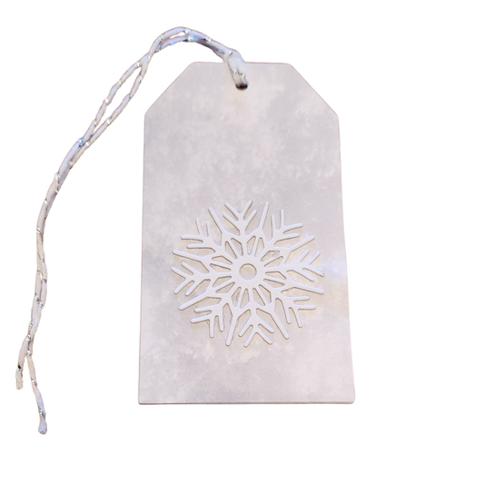 Winter Frost handmade gift tag featuring a dimensional white snowflake on a soft gray-and-white background with white and silver cord.